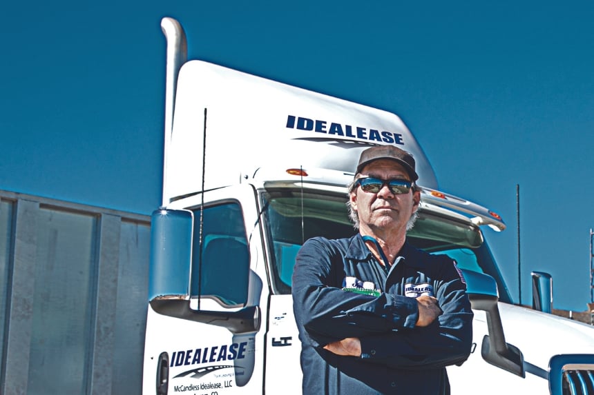 Trucker standing in front of Idealease truck
