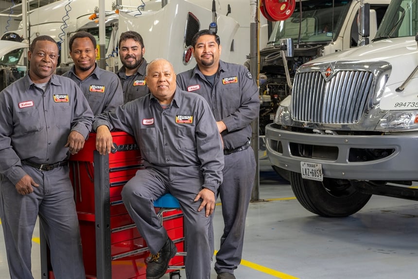 Five Rush Truck Leasing technicians smiling