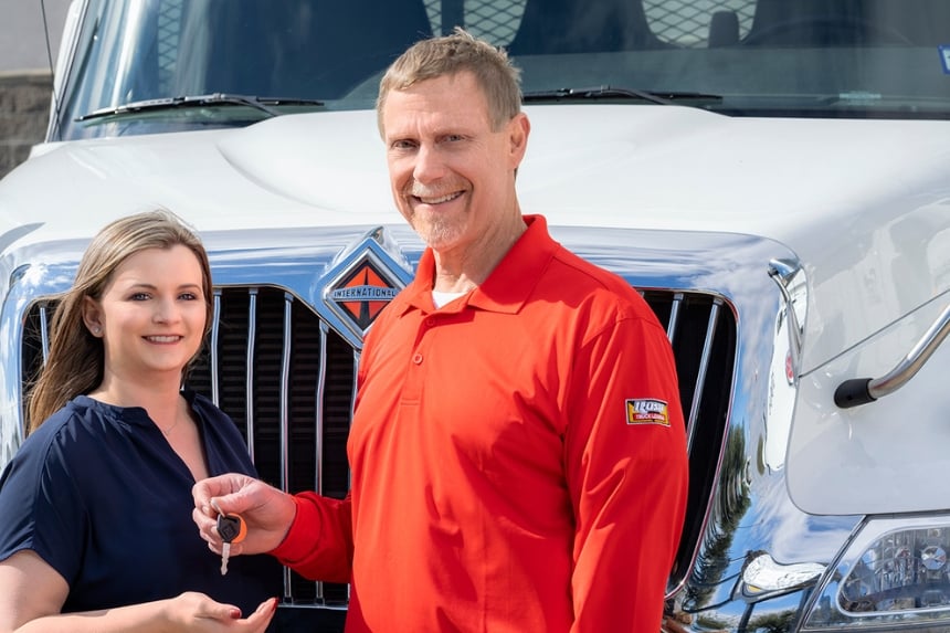 Rush Truck Leasing employee handing customer keys