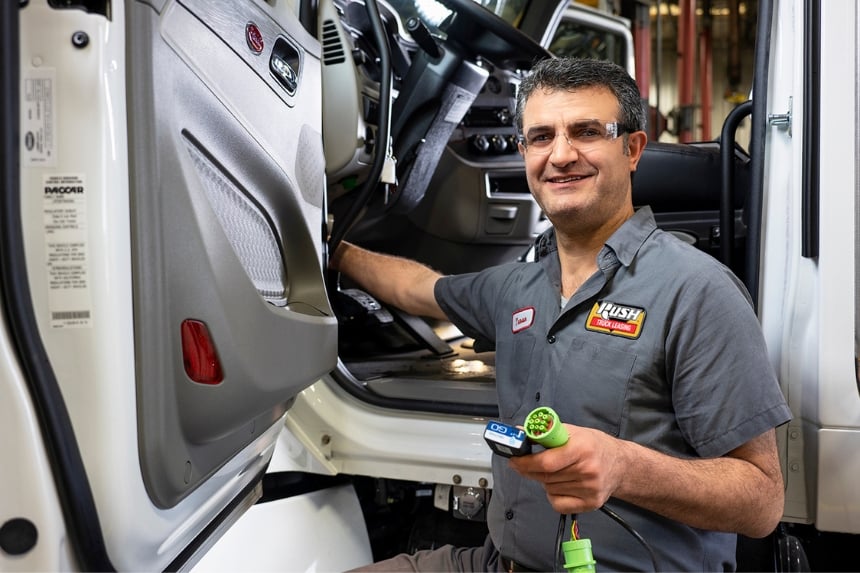 Technician installing GeoTab Go device