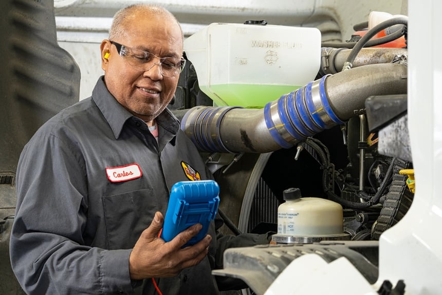 Technician testing truck electrical